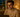 Young professional wearing blue light glasses on a laptop in a cosy London flat